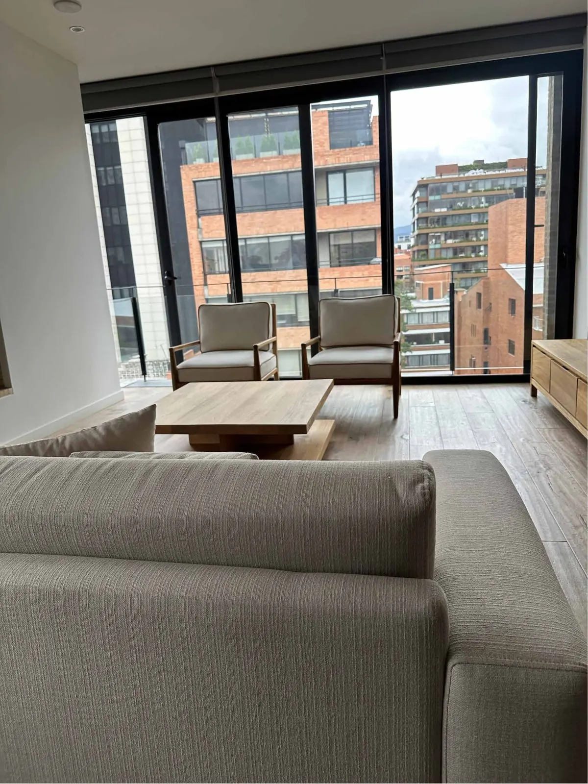 Furnished living room for rent with sofa and coffee table