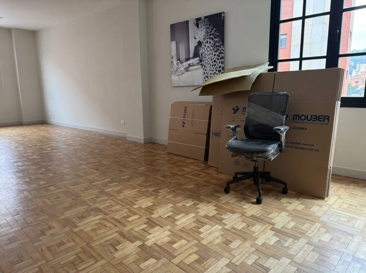Chair and Mouber cardboard boxes ready for an office move